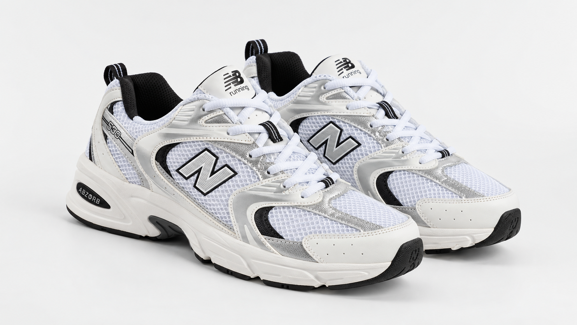 Белые New Balance 530 41252 с сеткой, серебристыми накладками и ABZORB